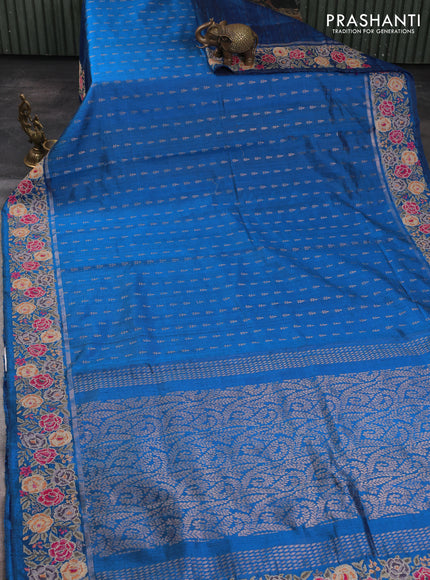 Pure dupion silk saree cs blue with allover zari woven buttas and zari woven floral embroidery border