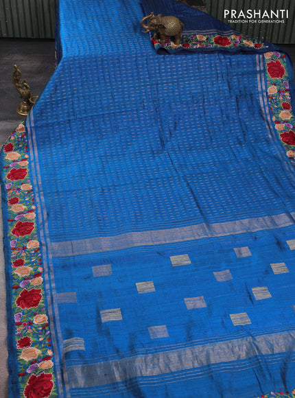 Pure dupion silk saree cs blue with allover zari woven butta weaves and zari woven floral embroidery border