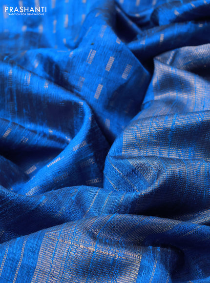 Pure dupion silk saree cs blue with allover zari woven butta weaves and zari woven floral embroidery border