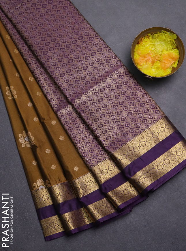 Semi soft silk saree dark mustard and purple with allover zari woven buttas and zari woven korvai border
