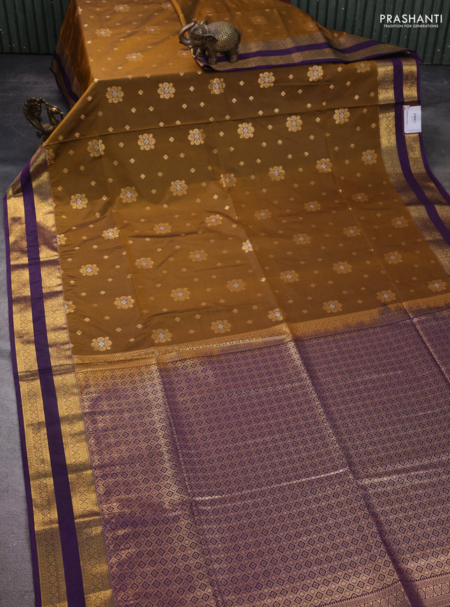 Semi soft silk saree dark mustard and purple with allover zari woven buttas and zari woven korvai border