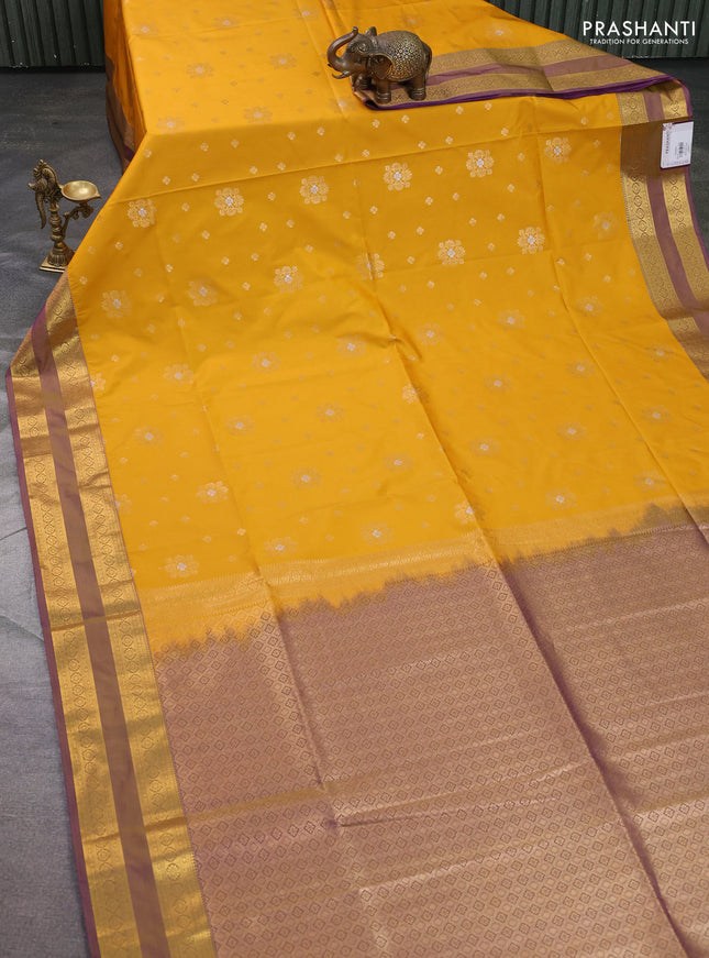 Semi soft silk saree mustard yellow and dual shade of purple with allover zari woven buttas and zari woven korvai border
