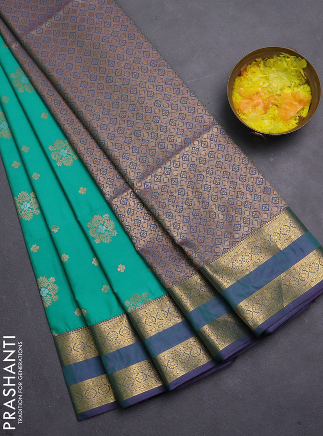 Semi soft silk saree teal green and purple with allover zari woven buttas and zari woven korvai border