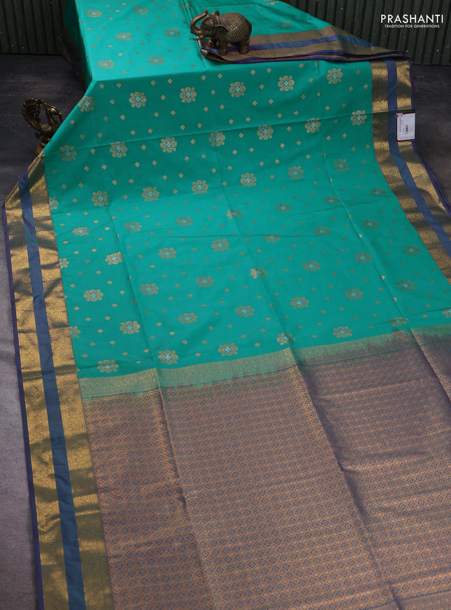 Semi soft silk saree teal green and purple with allover zari woven buttas and zari woven korvai border