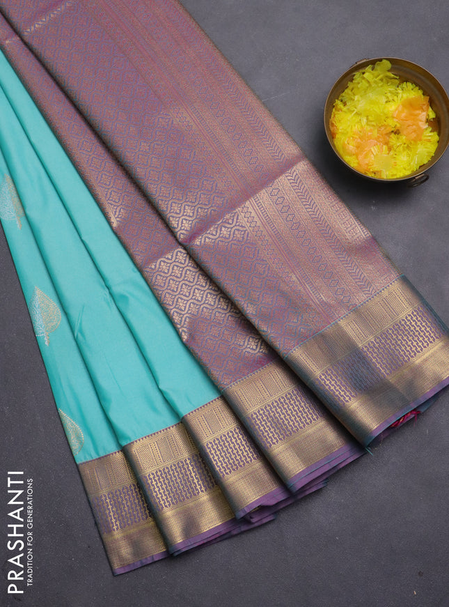 Semi soft silk saree teal blue and pink with allover zari woven buttas and zari woven korvai border
