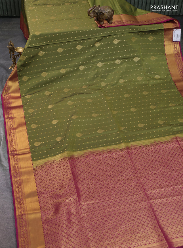 Semi soft silk saree mehendi green and magenta pink with allover zari woven buttas and zari woven korvai border