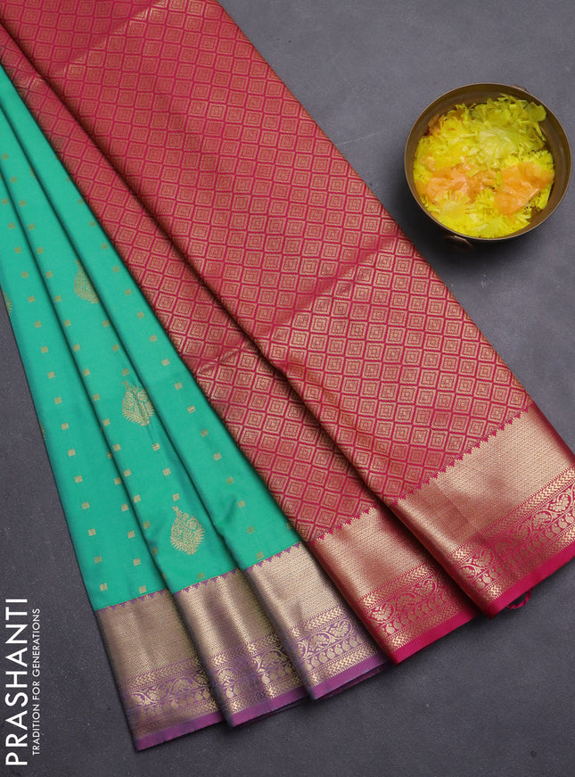 Semi soft silk saree teal green and pink with allover zari woven buttas and zari woven korvai border