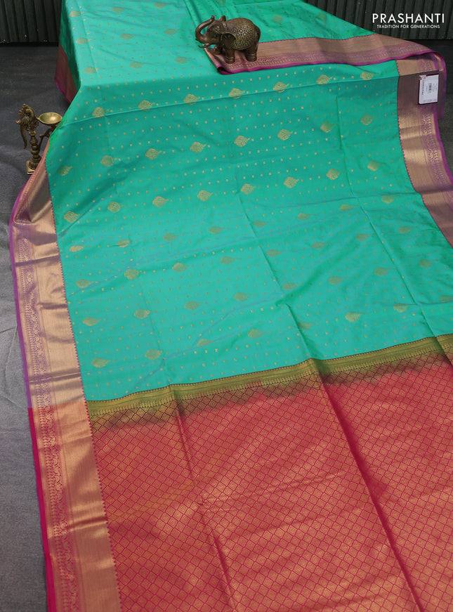 Semi soft silk saree teal green and pink with allover zari woven buttas and zari woven korvai border