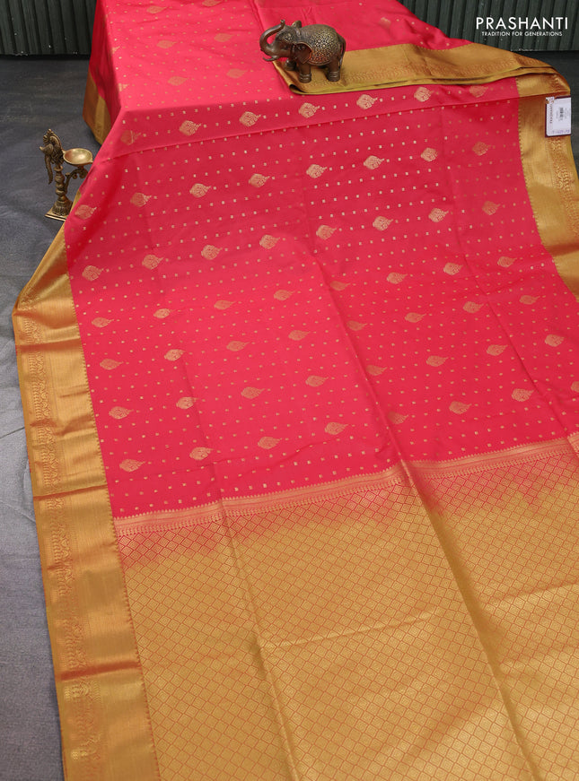 Semi soft silk saree peach shade and dark mustard with allover zari woven buttas and zari woven korvai border