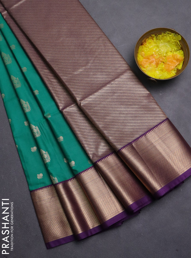 Semi soft silk saree teal green and purple with allover zari woven buttas and zari woven korvai border