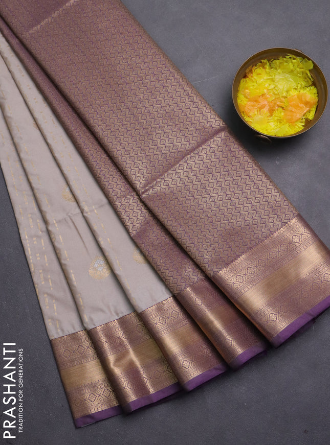 Semi soft silk saree beige and purple with allover zari woven buttas and zari woven korvai border