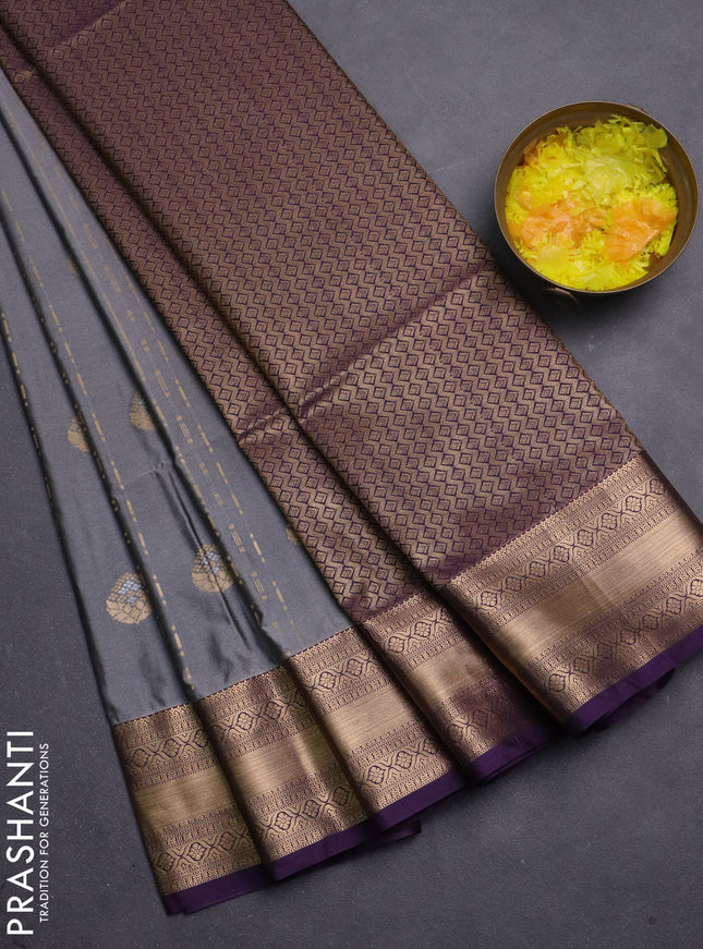 Semi soft silk saree grey and purple with allover zari woven buttas and zari woven korvai border