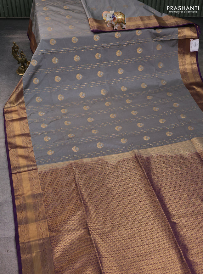 Semi soft silk saree grey and purple with allover zari woven buttas and zari woven korvai border