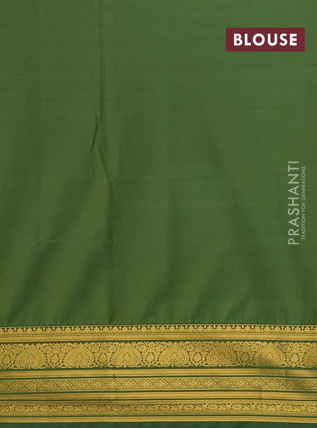 Semi soft silk saree mustard yellow and green with allover zari woven buttas and zari woven korvai border