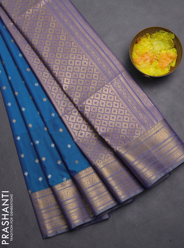 Semi soft silk saree blue and pastel green with allover zari woven buttas and zari woven korvai border