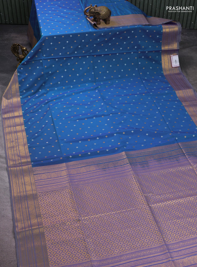 Semi soft silk saree blue and pastel green with allover zari woven buttas and zari woven korvai border