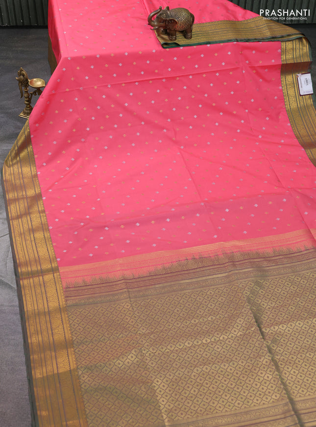 Semi soft silk saree peach pink and green with allover zari woven buttas and zari woven korvai border
