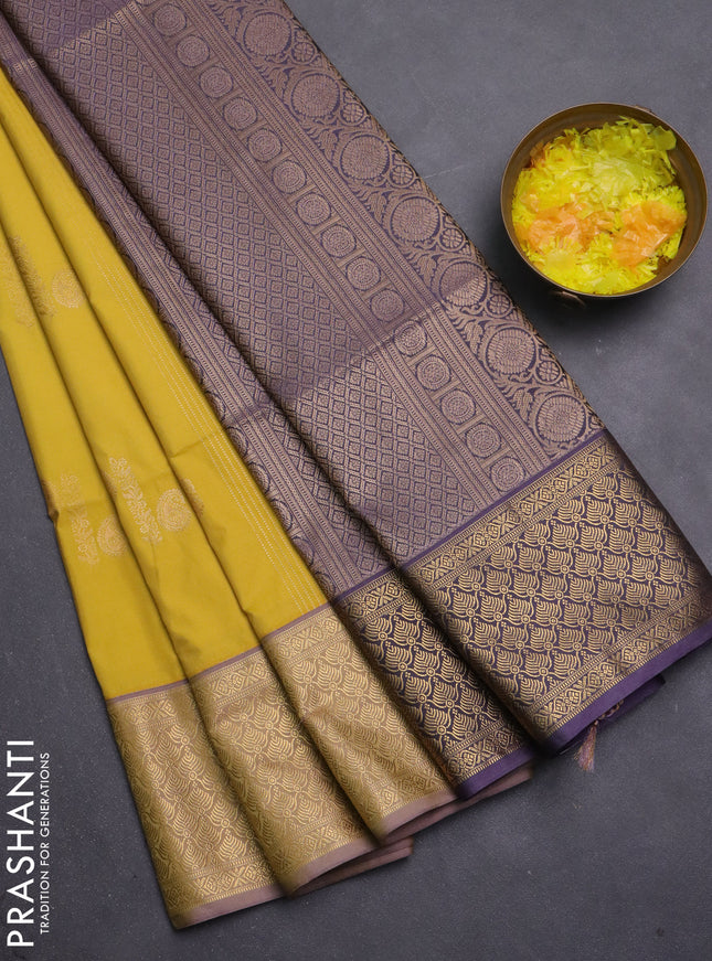 Semi soft silk saree yellow and pastel purple with allover zari weaves & buttas and zari woven korvai border