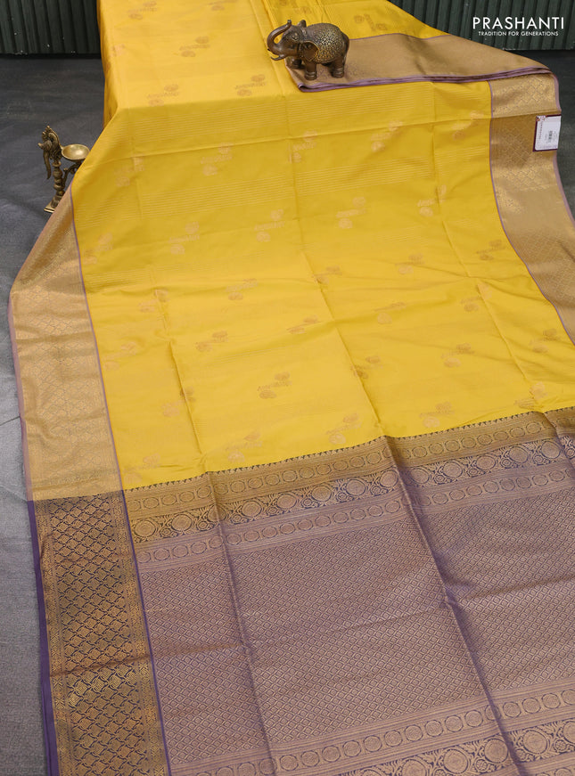 Semi soft silk saree yellow and pastel purple with allover zari weaves & buttas and zari woven korvai border