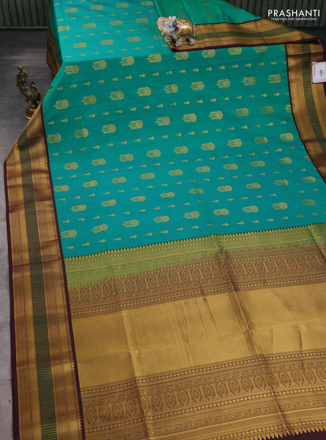 Semi soft silk saree green and coffee brown with allover zari woven buttas and zari woven border