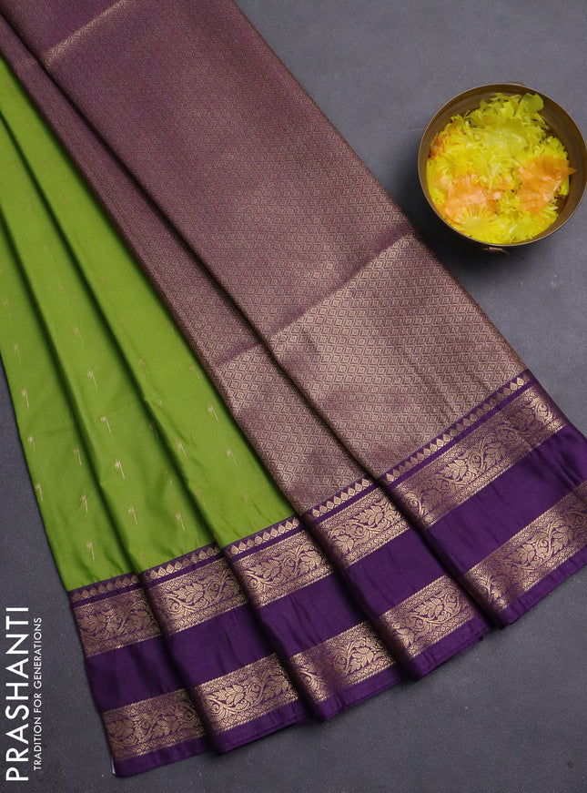 Semi soft silk saree light green and purple with allover zari woven buttas and rettapet zari woven border