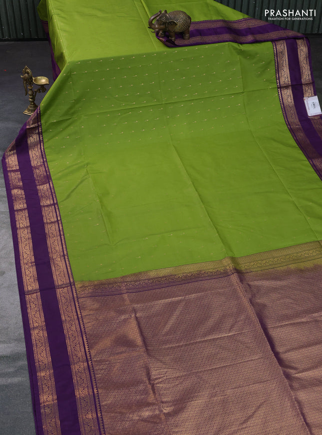 Semi soft silk saree light green and purple with allover zari woven buttas and rettapet zari woven border