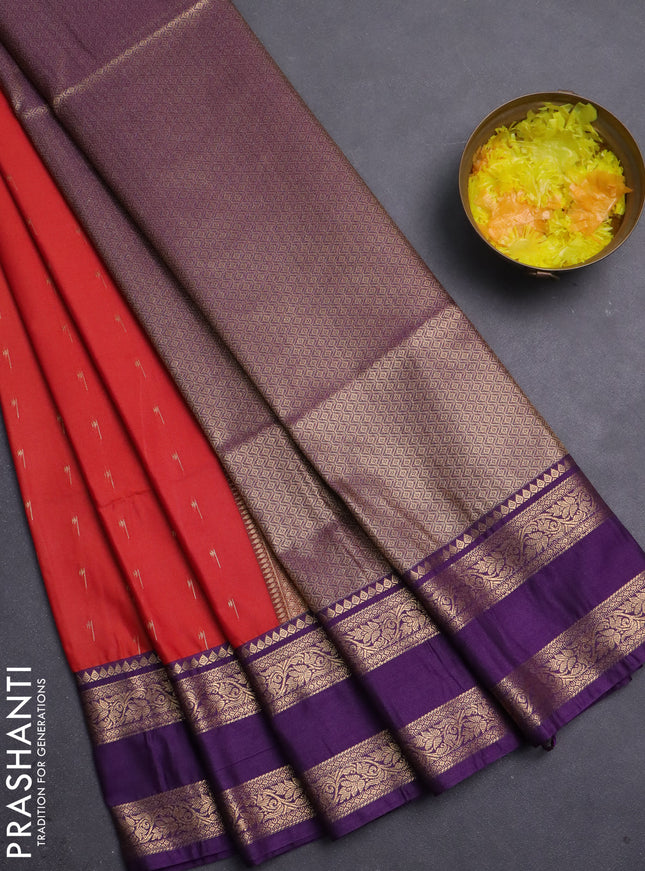 Semi soft silk saree rustic orange and purple with allover zari woven buttas and rettapet zari woven border