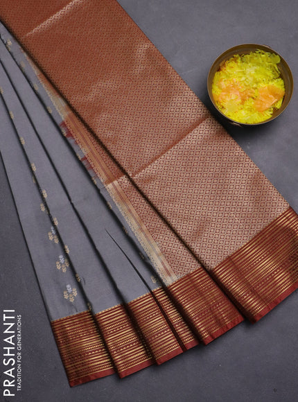 Semi soft silk saree grey and rust shade with allover zari woven buttas and zari woven korvai border