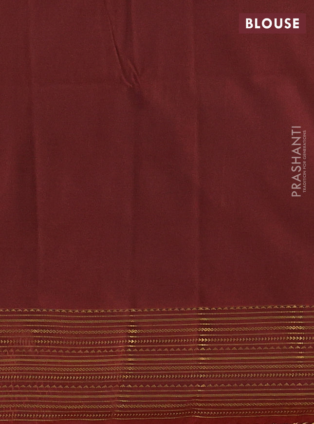 Semi soft silk saree green and rust shade with allover zari woven buttas and zari woven korvai border