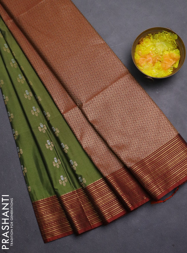 Semi soft silk saree sap green and rust shade with allover zari woven buttas and zari woven korvai border