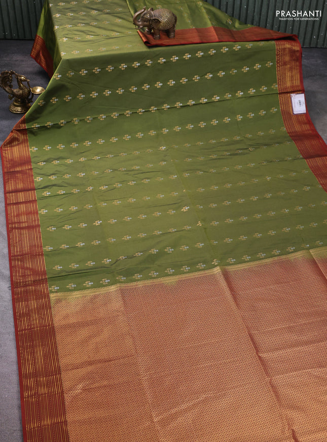 Semi soft silk saree sap green and rust shade with allover zari woven buttas and zari woven korvai border