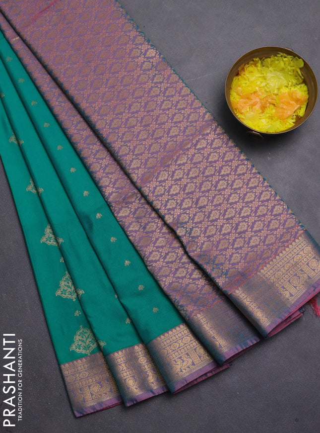 Semi soft silk saree teal green and peach shade with allover zari woven buttas and zari woven korvai border