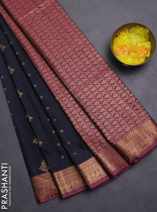 Semi soft silk saree black and peach pink with allover zari woven buttas and zari woven korvai border