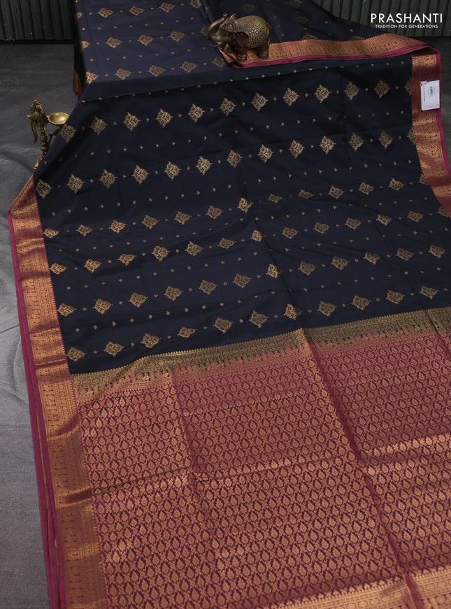 Semi soft silk saree black and peach pink with allover zari woven buttas and zari woven korvai border