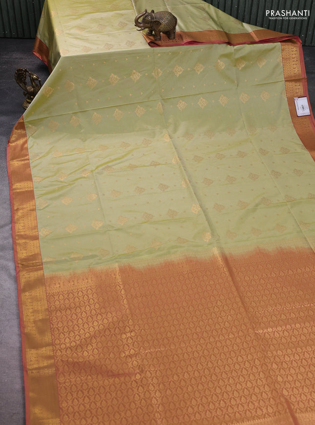 Semi soft silk saree pista green and pink with allover zari woven buttas and zari woven korvai border