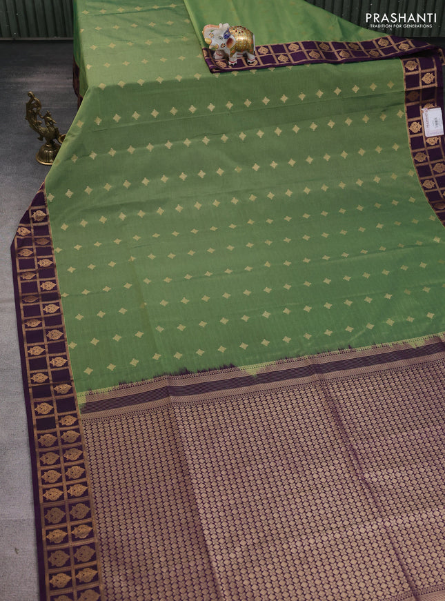 Semi soft silk saree sap green and purple with allover zari woven buttas and zari woven border