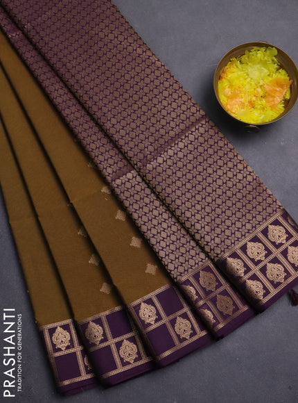 Semi soft silk saree dark mehendi green and purple with allover zari woven buttas and zari woven border