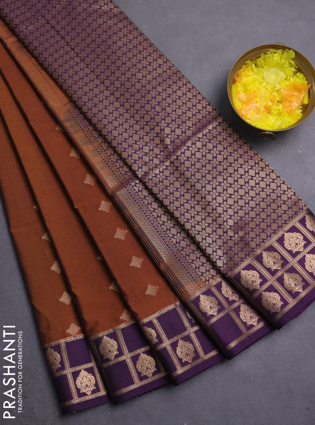 Semi soft silk saree rust shade and purple with allover zari woven buttas and rettapet zari woven border