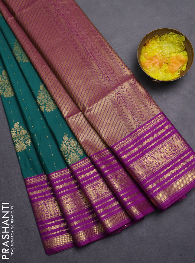 Semi soft silk saree peacock green and violet with allover zari woven buttas and long zari woven border