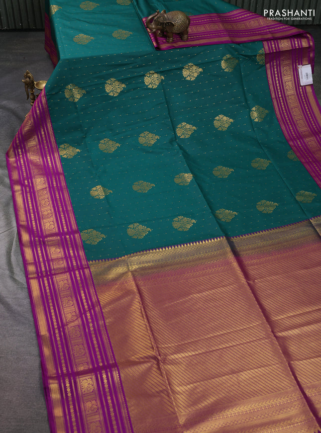 Semi soft silk saree peacock green and violet with allover zari woven buttas and long zari woven border
