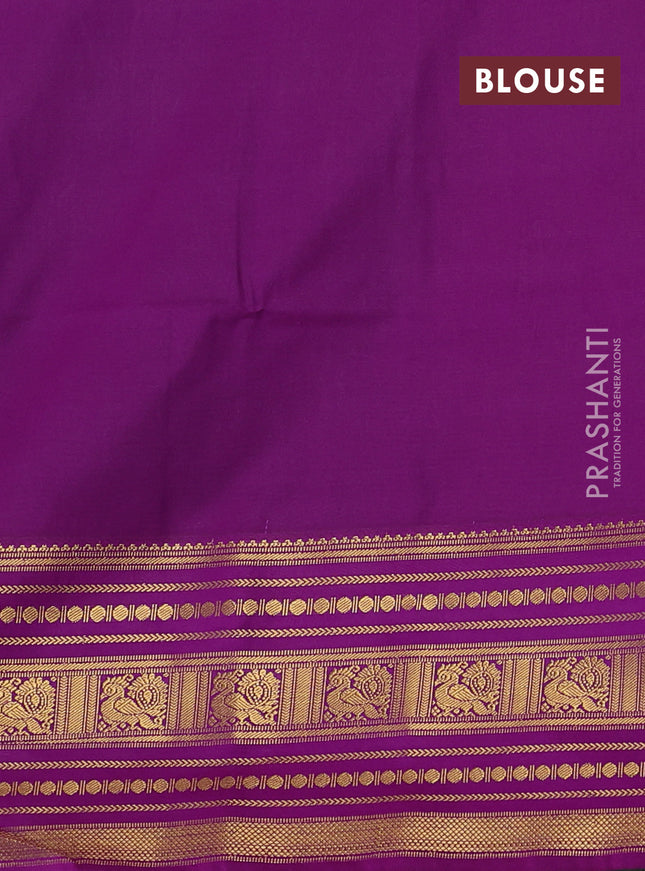 Semi soft silk saree peacock green and violet with allover zari woven buttas and long zari woven border