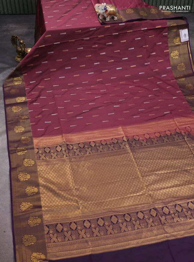 Semi soft silk saree wine shade and purple with allover zari woven buttas and zari woven border