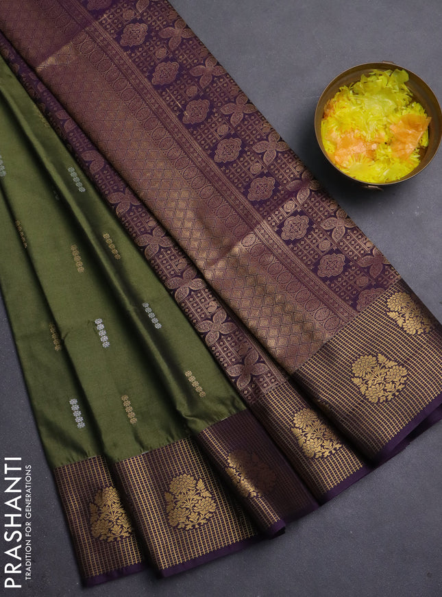Semi soft silk saree mehendi green and purple with allover zari woven buttas and zari woven border