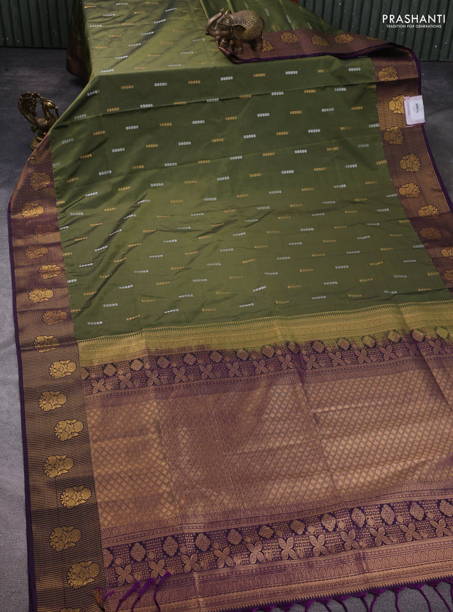 Semi soft silk saree mehendi green and purple with allover zari woven buttas and zari woven border