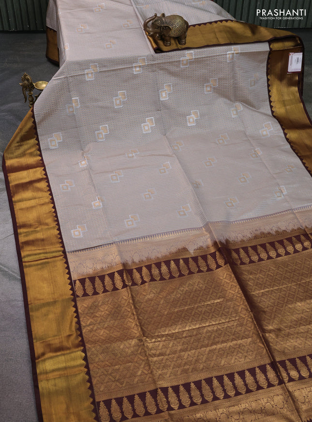 Semi soft silk saree beige and coffee brown with allover zari weaves & buttas and zari woven korvai border