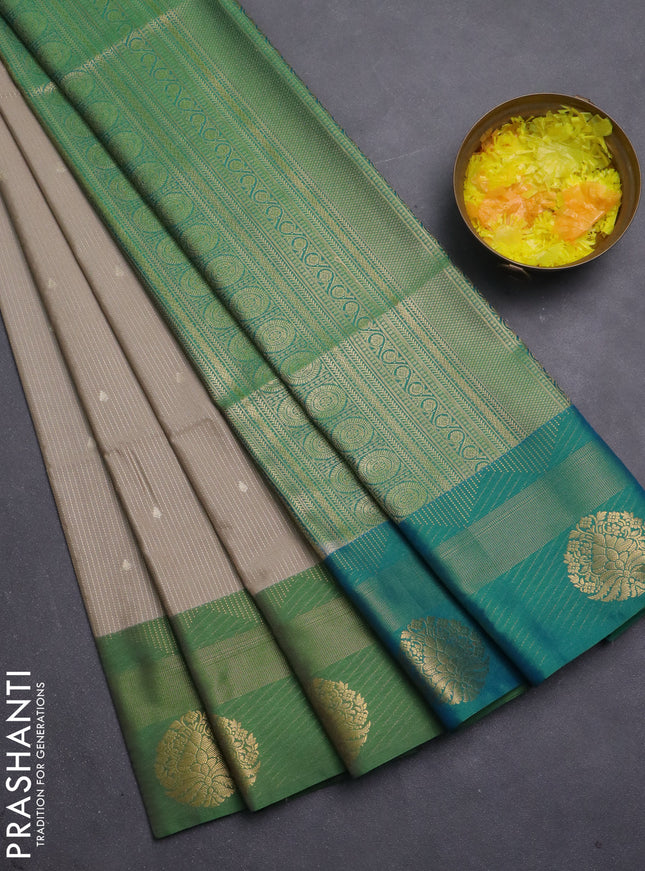 Semi soft silk saree beige and green with allover zari weaves & buttas and zari woven border