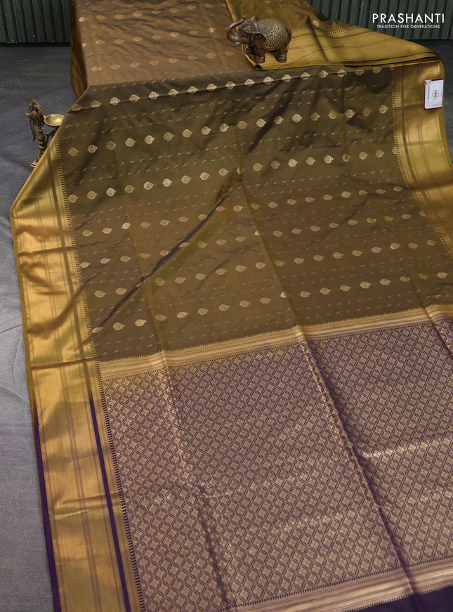 Semi soft silk saree mehendi green and purple with allover zari woven buttas and zari woven korvai border