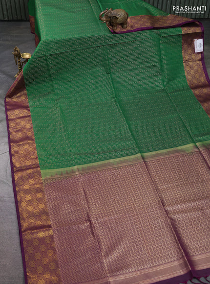 Semi soft silk saree green and purple with allover small checks & buttas and zari woven border