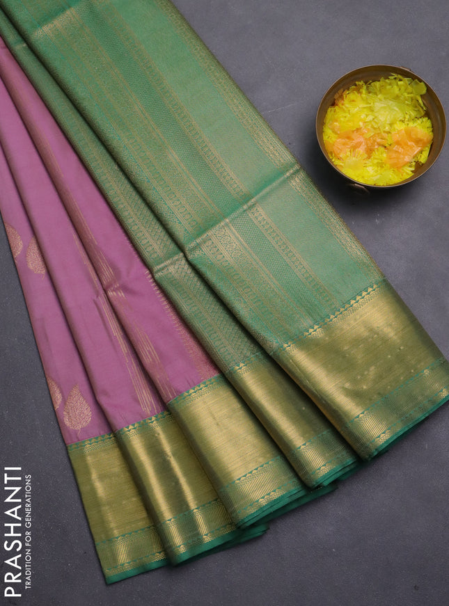 Semi soft silk saree mauve pink and green with allover zari weaves & buttas and zari woven border