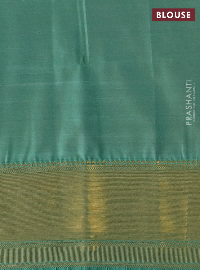 Semi soft silk saree mauve pink and green with allover zari weaves & buttas and zari woven border